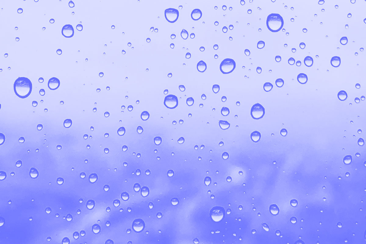 Fotografia de uma janela em dia de chuva alusiva ao conceito de transparência